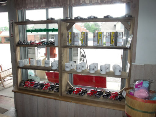 Mugs, Model Old-Fashioned Gas Pumps and Die-Cast Trucks